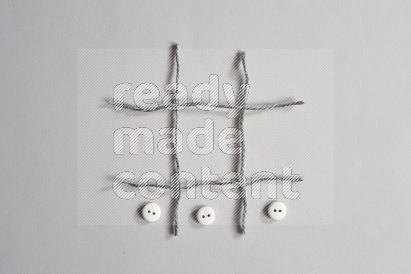 White buttons placed on grey background