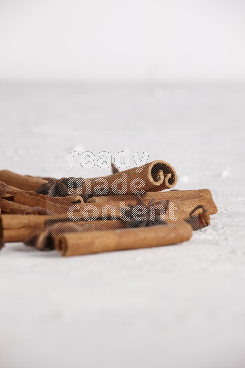 cinnamon sticks with star anise on white background