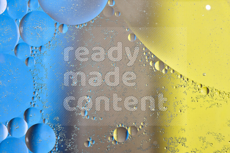 لقطات مقربة لفقاعات من الزيت على سطح الماء باللون الأصفر والبني والأزرق