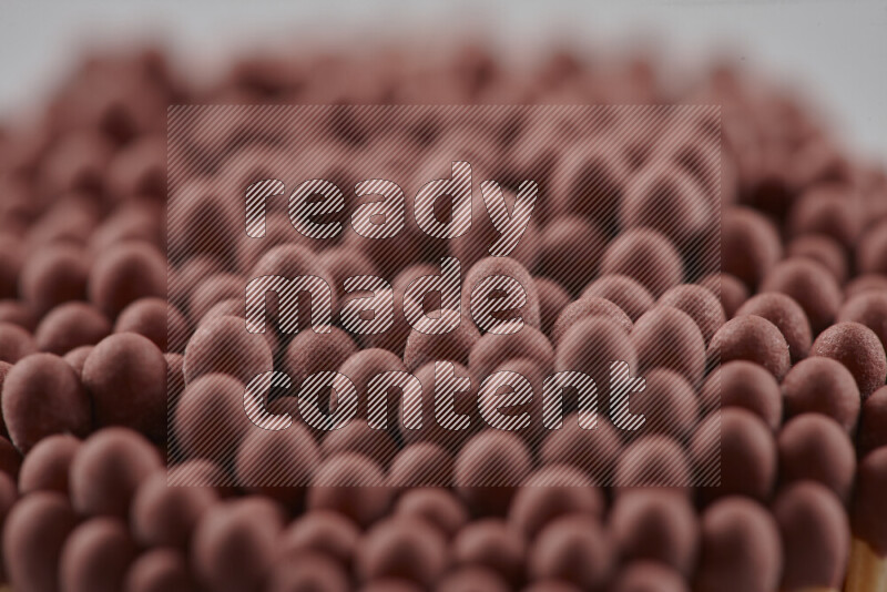 A close-up of a bundle of matches on grey background