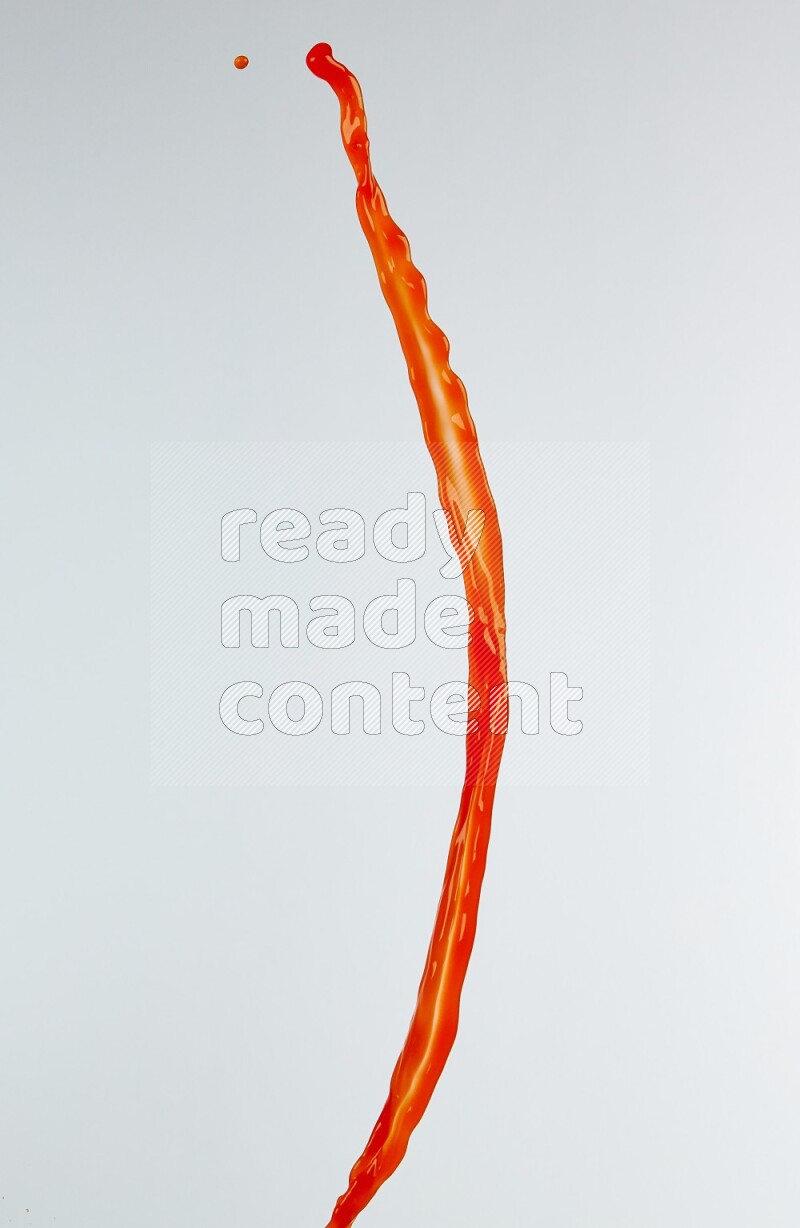 Orange liquid splash and drops on white background