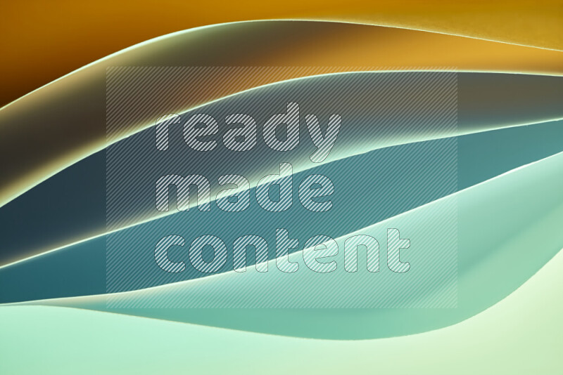 This image showcases an abstract paper art composition with paper curves in green and orange gradients created by colored light