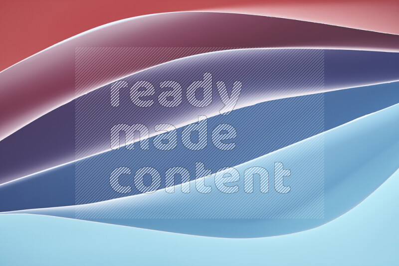 This image showcases an abstract paper art composition with paper curves in blue and red gradients created by colored light