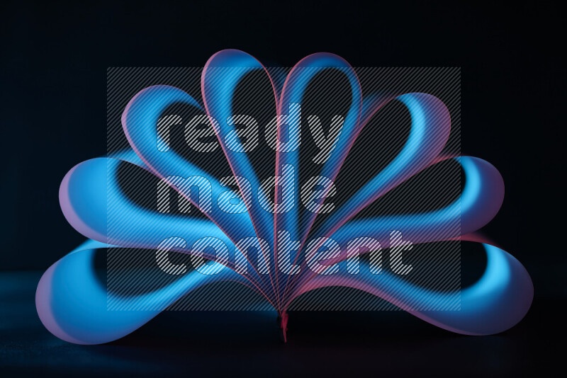 An abstract art piece displaying smooth curves in blue and pink gradients created by colored light