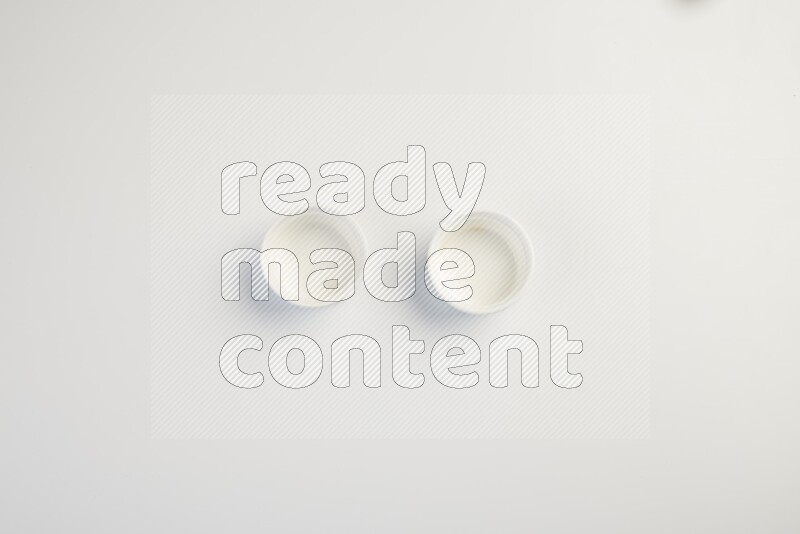 white ceramic round sauce dish on white countertop