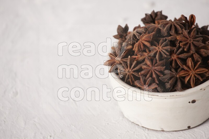 Star Anise in a white bowl on white background
