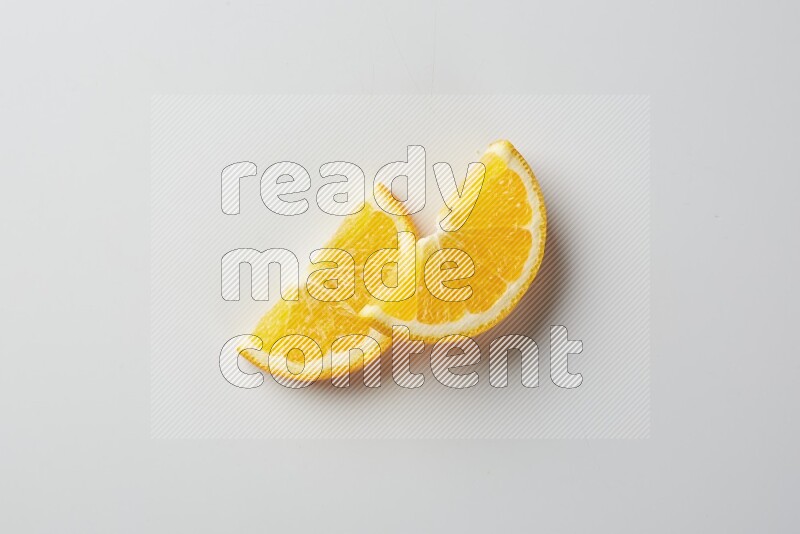 Two halves of an orange slices on white background
