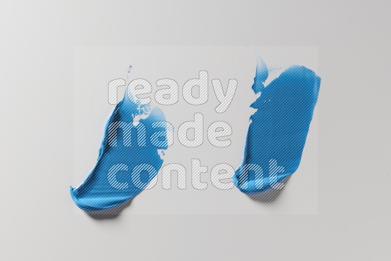 Blue painting knife strokes on white background