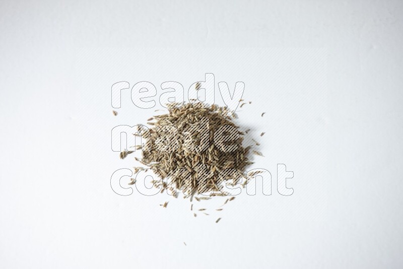 Cumin seeds on white flooring