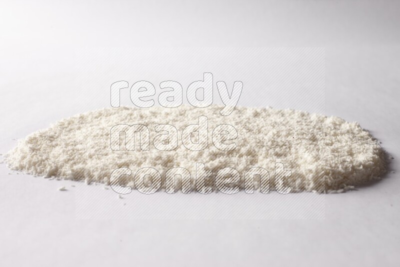 Desiccated coconuts on white background
