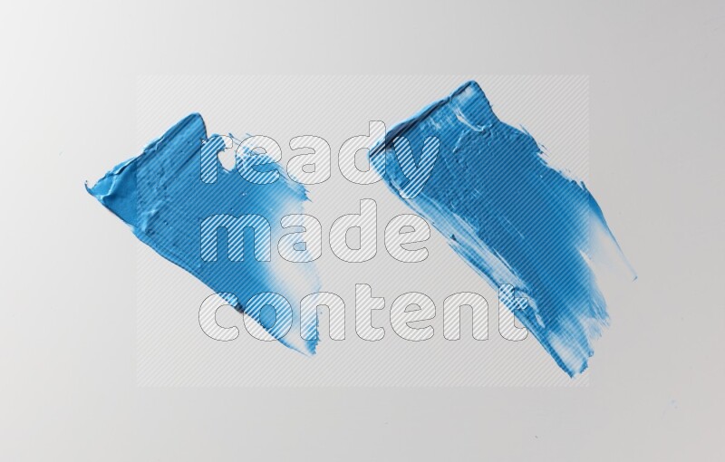 Blue painting knife strokes on white background