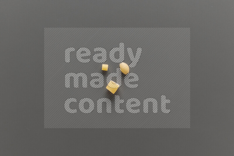 Different pasta types on grey background