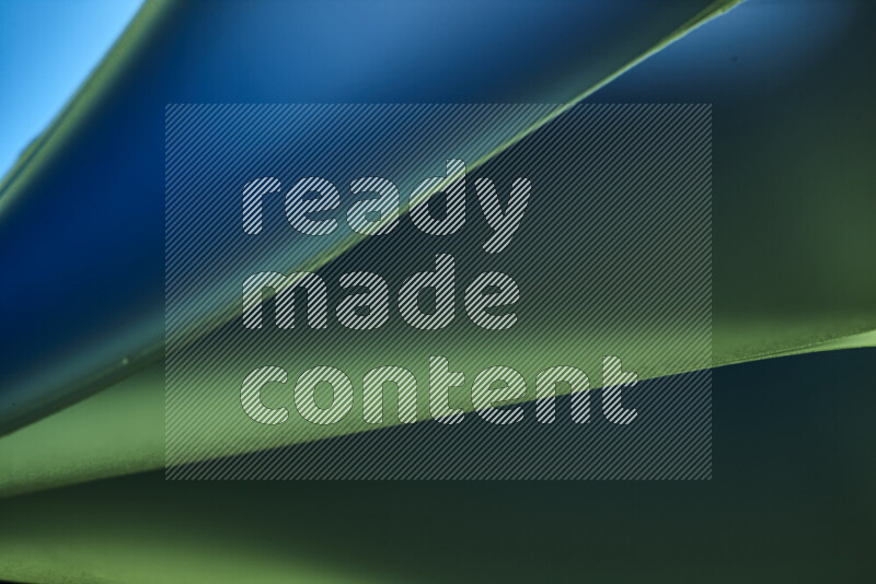 An abstract art piece displaying smooth curves in cold gradients created by colored light