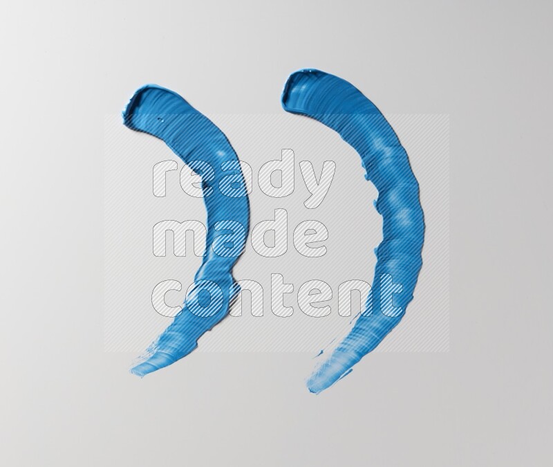 Blue curved painting knife strokes on white background