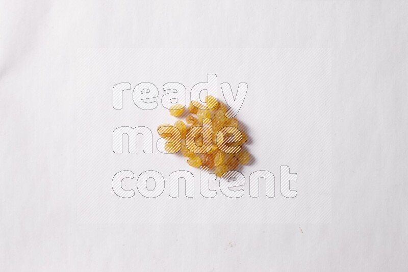 Raisins on white background