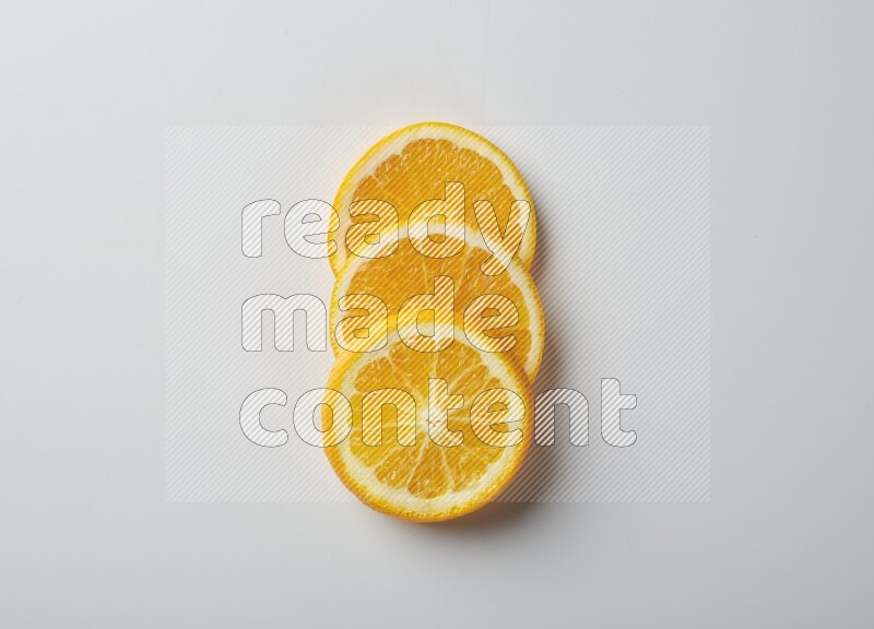 Three orange slices on a white background