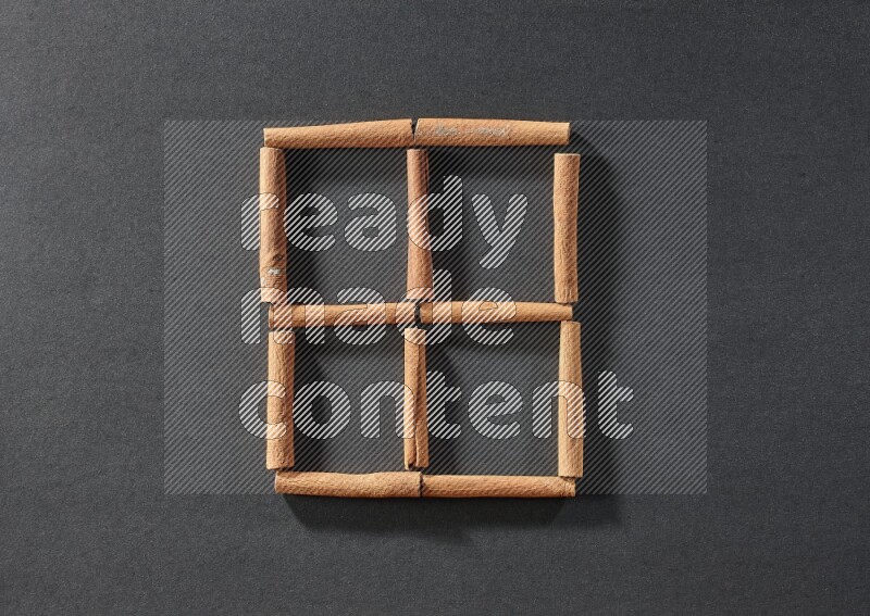 4 squares of cinnamon sticks on black flooring