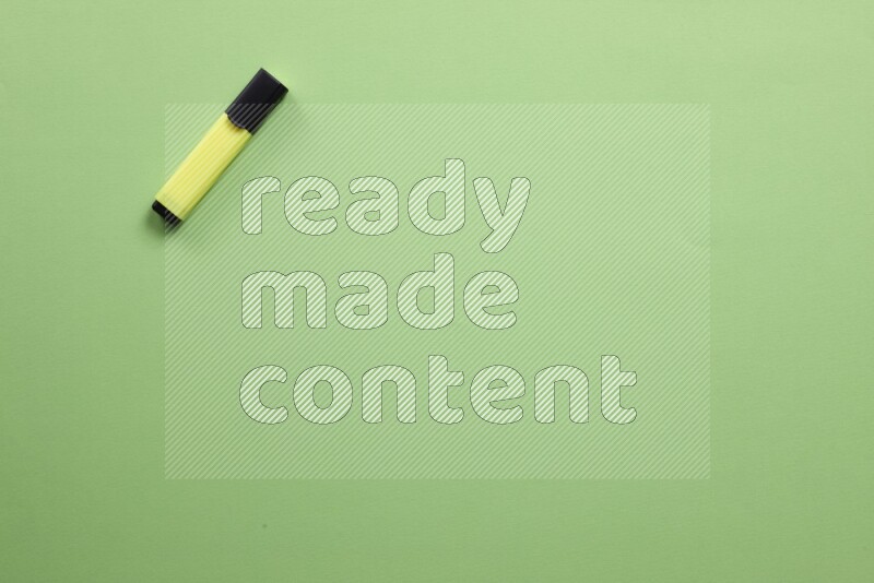 Multicolored highlighter pens on green background