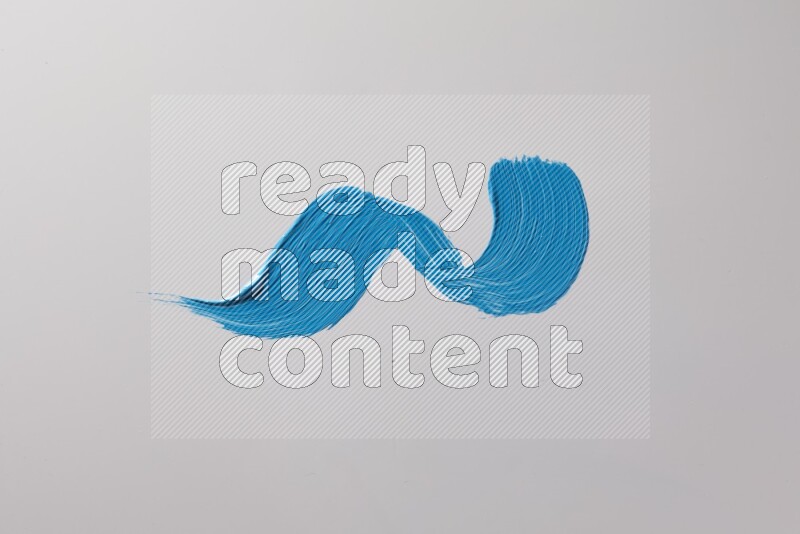 A single blue zigzag brush stroke on a white background