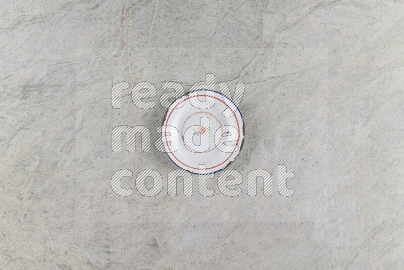 A vintage metal plate on grey marble background
