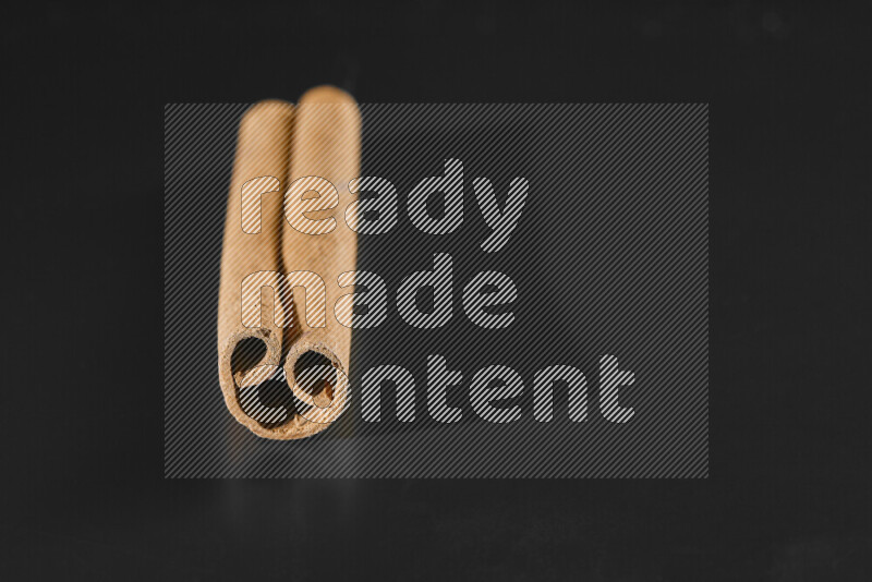 Cinnamon sticks on black background