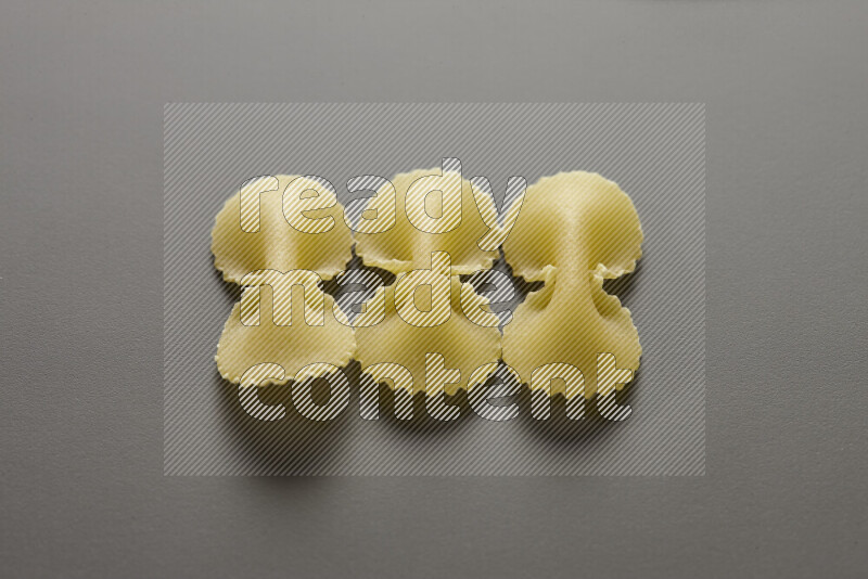 Fiocchi pasta on grey background
