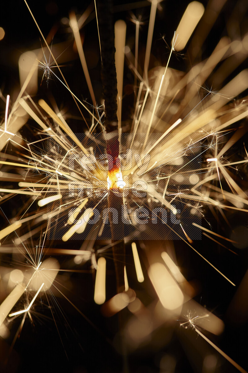 A close-up image of sparkler candle isolated on black background