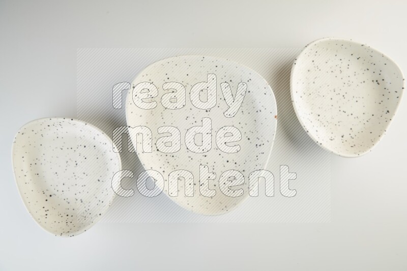 white plate with black dots on white background