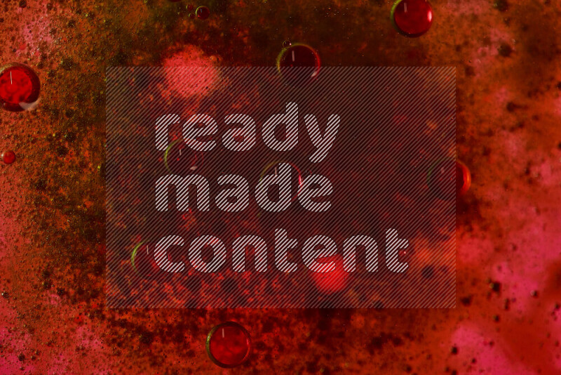 Close-ups of abstract black watercolor drops on oil Surface on red background