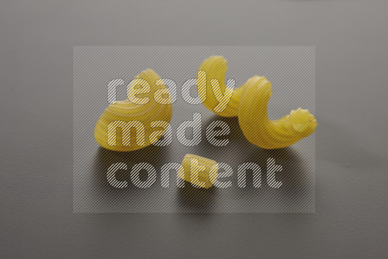 Different pasta types on grey background