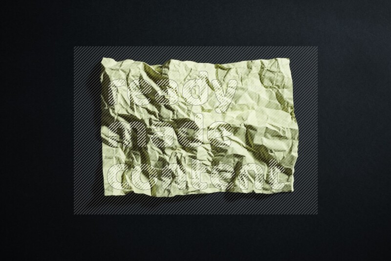 Yellow paper sheet on black background