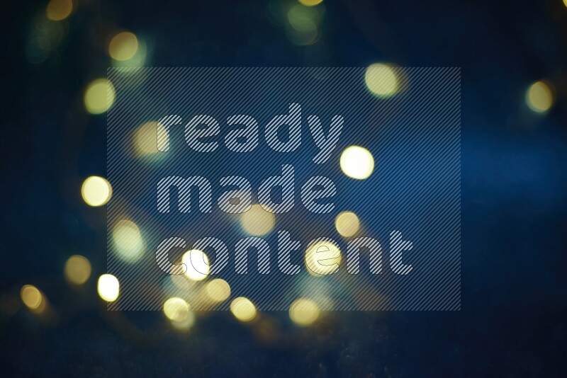 Bokeh light in yellow with blue background