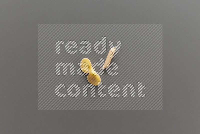 Fiocchi pasta with other types of pasta on grey background
