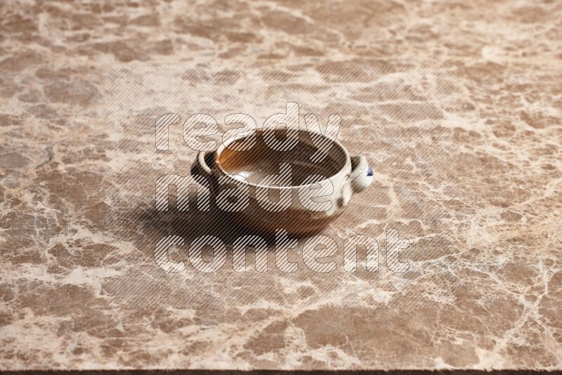 Multicolored Pottery Bowl on Beige Marble Flooring