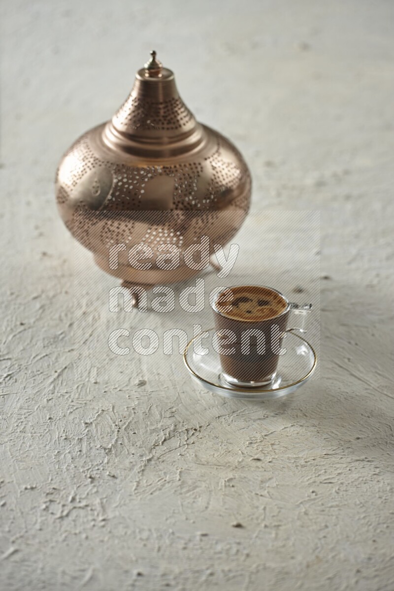 A golden lantern with different drinks, dates, nuts, prayer beads and quran on textured white background