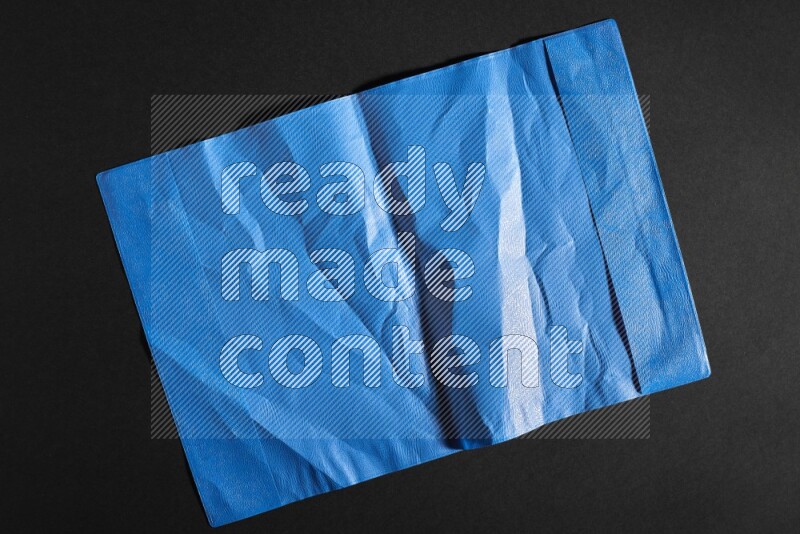 Colored plastic textures on black background