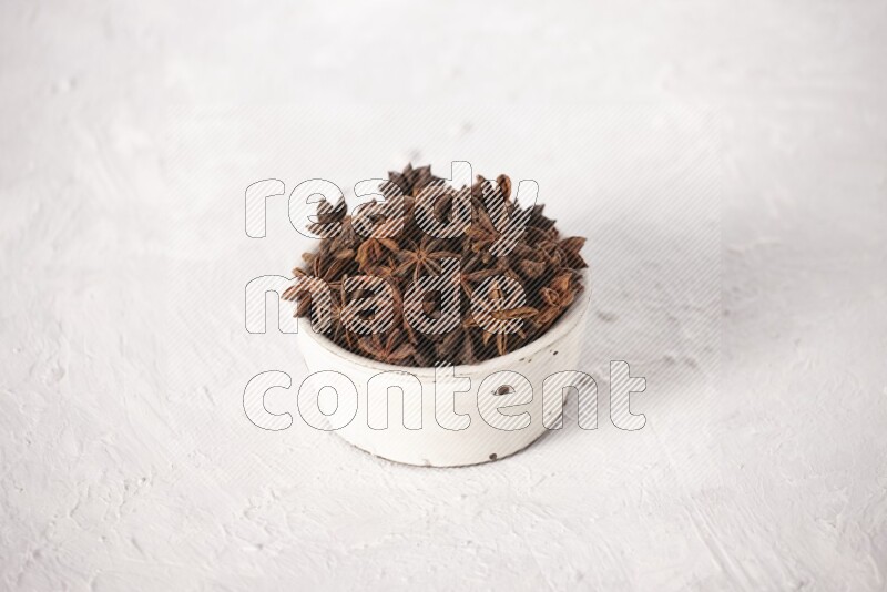 Star Anise in a white bowl on white background