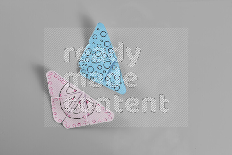 Origami butterfly on grey background