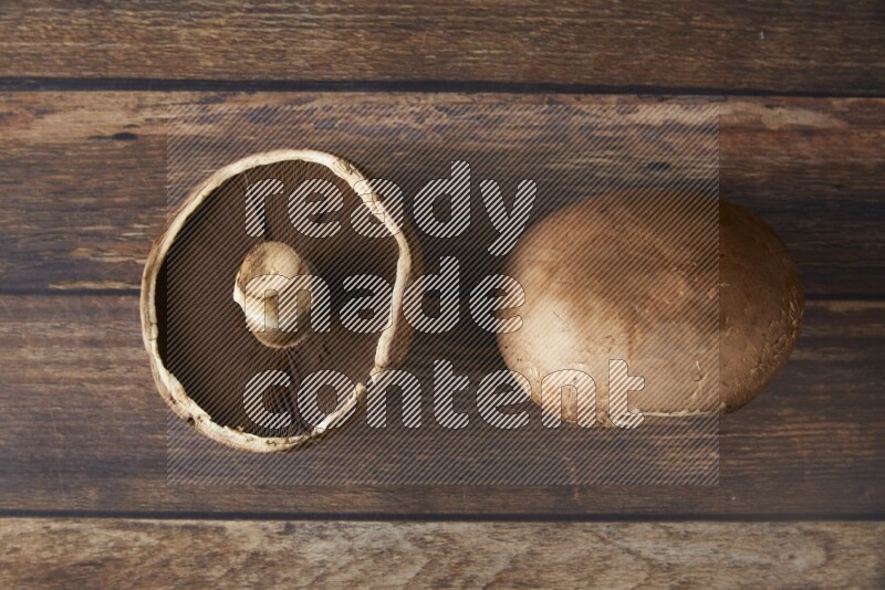 Fresh portobello mushroom topview on a wooden textured background