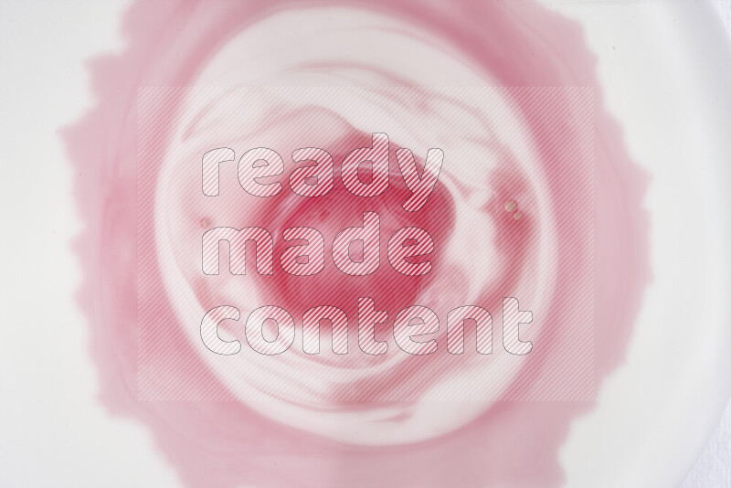 A close-up of abstract swirling patterns in red and white