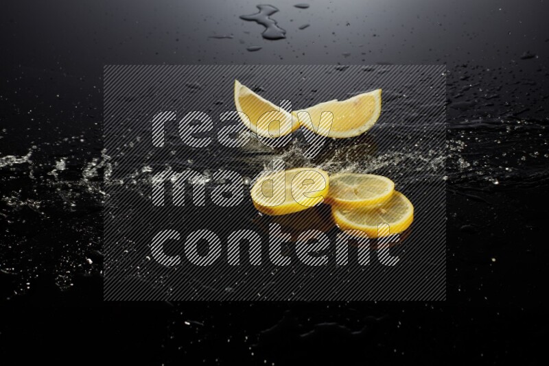 Lemon slices with water drops, and droplets on black background