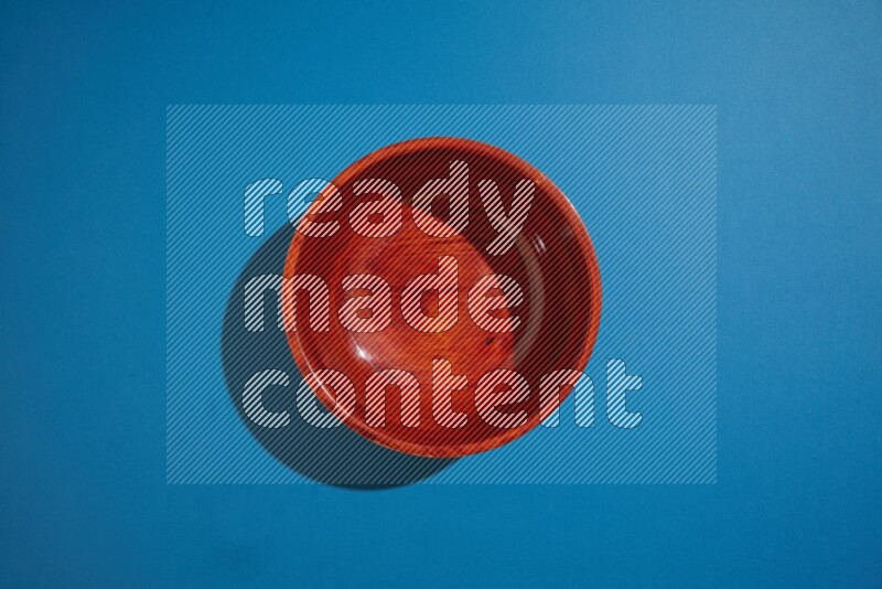 brown bowl on blue background