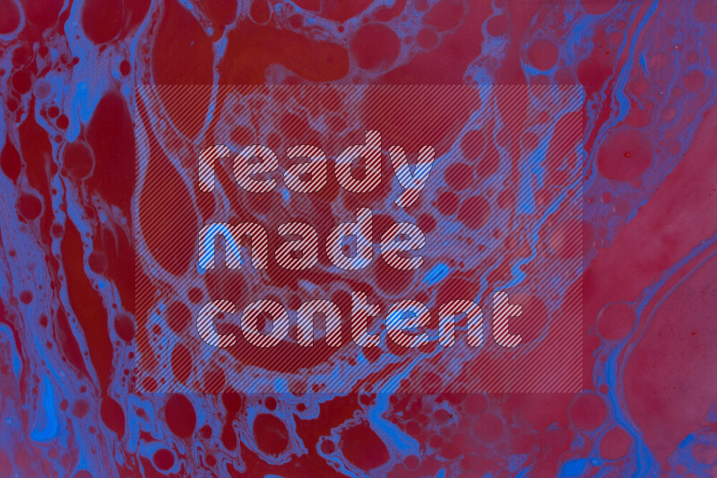 The image depicts a marbling effect with swirling patterns of red and blue