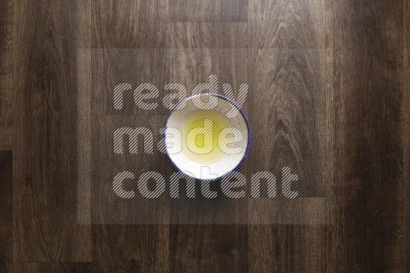 A bowl full of spices and salad dressing ingredients on wooden background