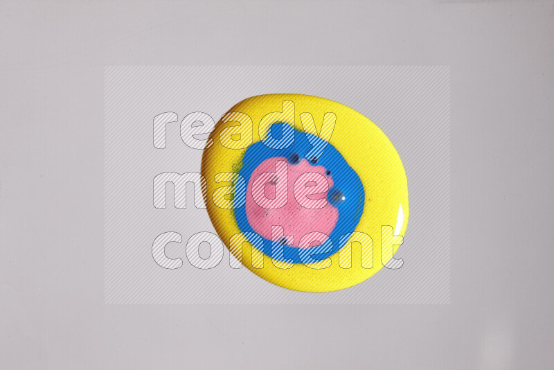 Close-ups of assorted colors blending on a grey background