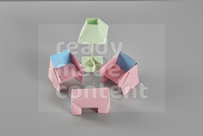 Origami living room on grey background