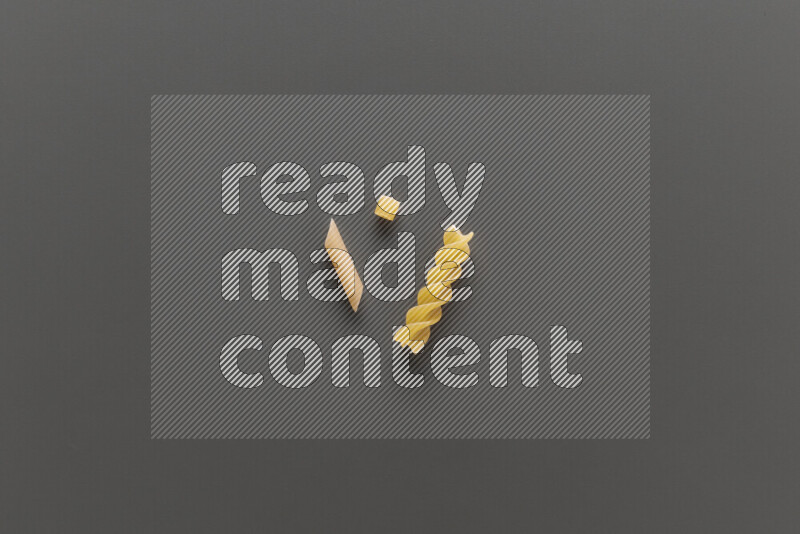 Different pasta types on grey background