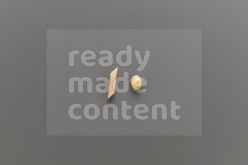 Mini penne pasta with other types of pasta on grey background
