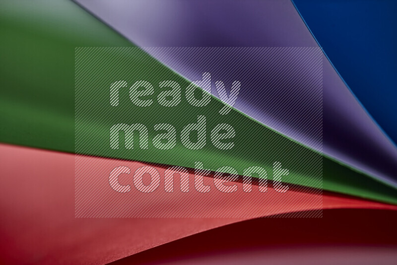 An abstract art showing colorful paper sheets arranged in an overlapping curves