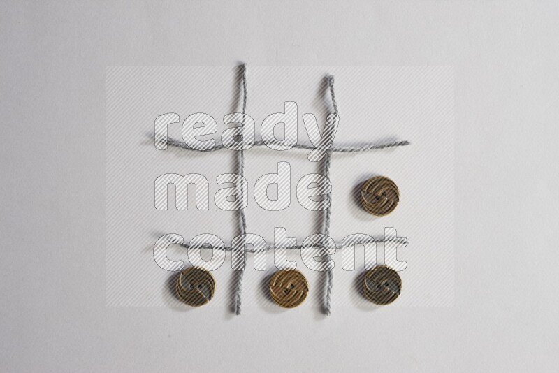 Metal buttons placed on grey background